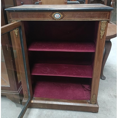 187 - A 19th century walnut pier cabinet, the top rail inset with an oval porcelain plaque decorated flowe... 