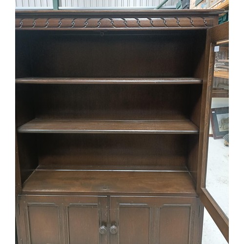 179 - An Ercol display cabinet, 101 cm widePlease note collection is from TA9 4LJ only on 22nd, 23rd, 24th... 