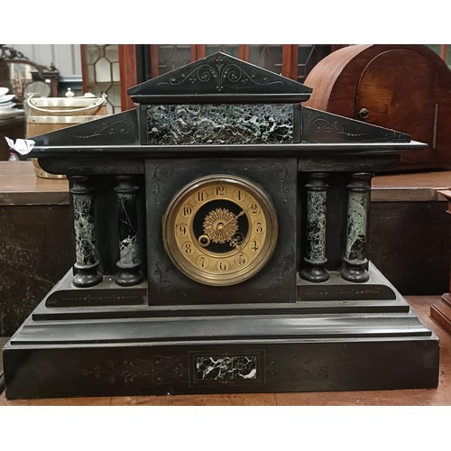 166 - A mantle clock, with a twin train eight day movement striking on a bell, in a polished slate case, 3... 