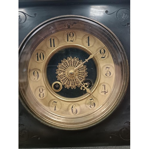 166 - A mantle clock, with a twin train eight day movement striking on a bell, in a polished slate case, 3... 