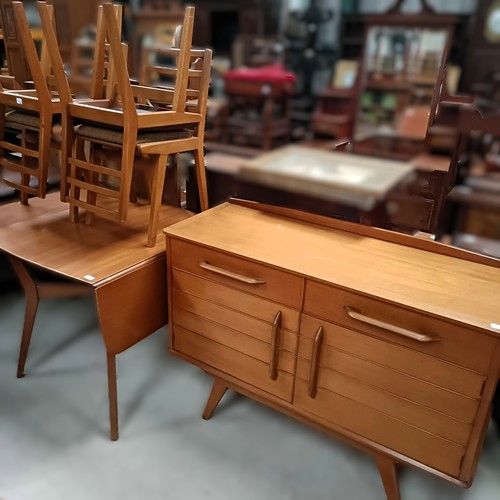 162 - A teak sideboard, with two drawers and two cupboard doors, matching table and four chairsPlease note... 