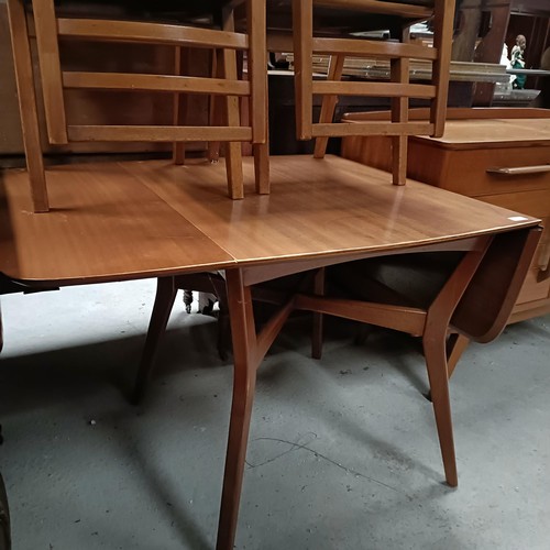 162 - A teak sideboard, with two drawers and two cupboard doors, matching table and four chairsPlease note... 