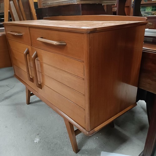 162 - A teak sideboard, with two drawers and two cupboard doors, matching table and four chairsPlease note... 