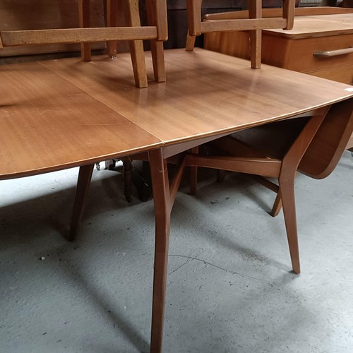 162 - A teak sideboard, with two drawers and two cupboard doors, matching table and four chairsPlease note... 