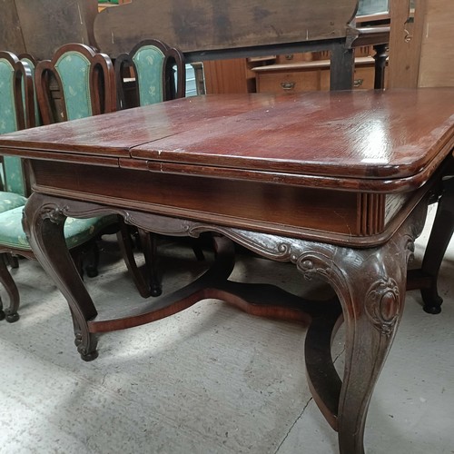 161 - An early 20th century French oak draw leaf dining table on carved cabriole legs, 125 cm x 103 cm, an... 