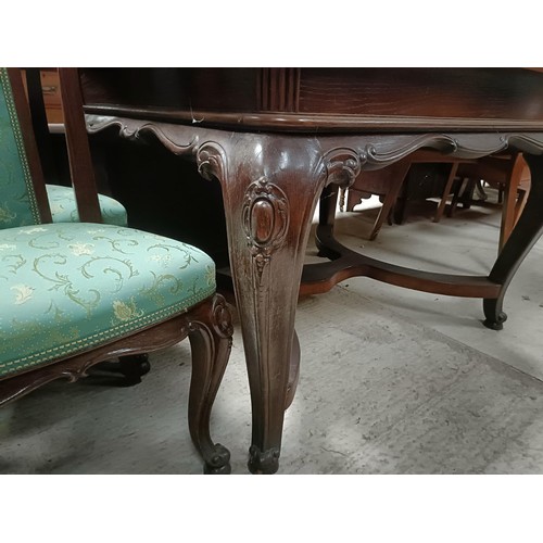 161 - An early 20th century French oak draw leaf dining table on carved cabriole legs, 125 cm x 103 cm, an... 