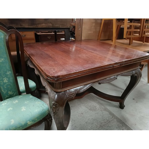 161 - An early 20th century French oak draw leaf dining table on carved cabriole legs, 125 cm x 103 cm, an... 