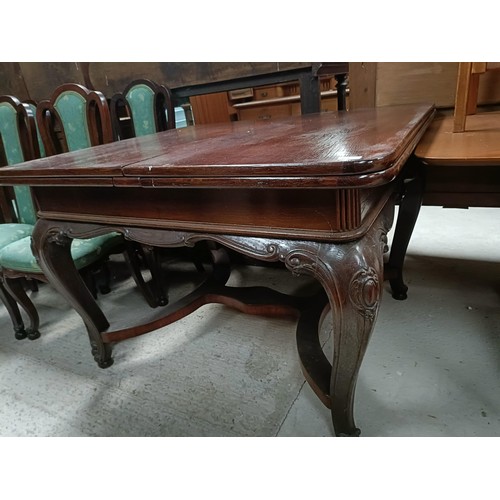 161 - An early 20th century French oak draw leaf dining table on carved cabriole legs, 125 cm x 103 cm, an... 