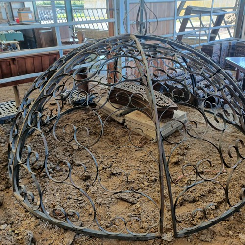 392 - A wrought iron garden Gazebo the supports in the from of columns, approx. 8ft diameter, unassembled,... 