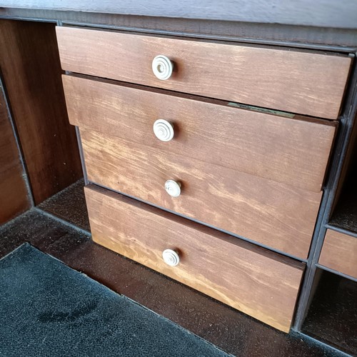 77 - A George III mahogany secretaire bookcase, the top with two glazed doors, above a fitted drawer, and... 