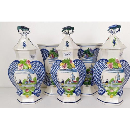 1123 - A Delft garniture, comprising three vases with lids, 34 cm high, and a pair of vases, 26 cm high (5)