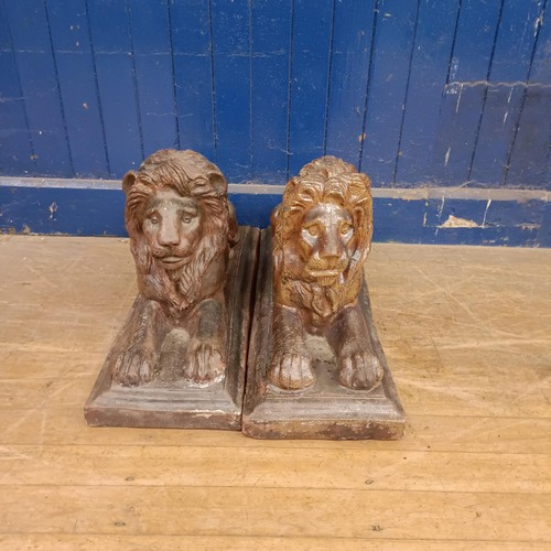 1332 - A pair of stoneware garden lions, on rectangular bases, 75 cm wide