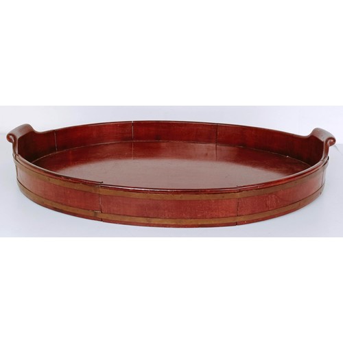 1125 - A 19th century mahogany and brass bound oval tray, 60 cm wide