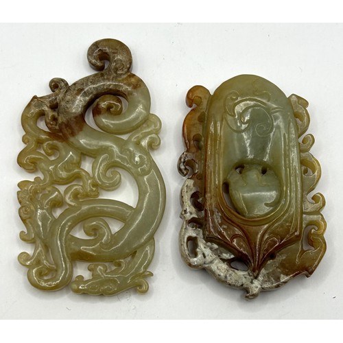 808 - A Chinese carved green stone plaque, decorated dragon, 8 cm wide, and another, 6 cm wide (2)