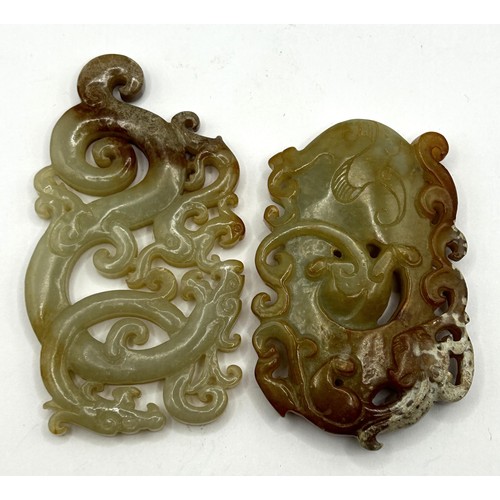 808 - A Chinese carved green stone plaque, decorated dragon, 8 cm wide, and another, 6 cm wide (2)