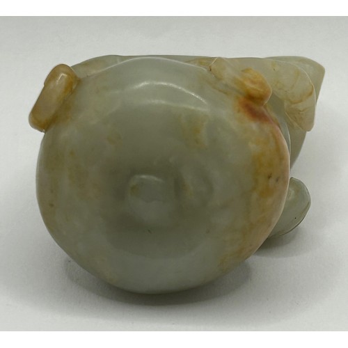 815 - A Chinese carved green stone figure of a monkey on a gourd, 6 cm wide