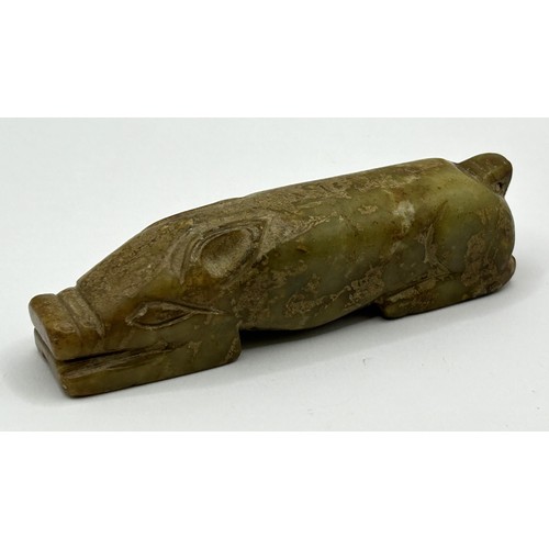 819 - A Chinese carved green stone figure of a pig, 10 cm wide