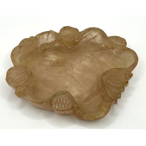 832 - A Chinese rose quartz shallow bowl, carved flowers, 11 cm wide