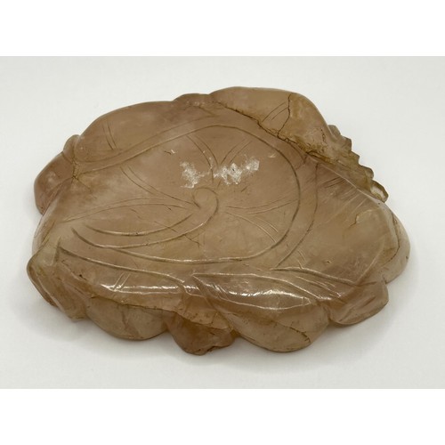 832 - A Chinese rose quartz shallow bowl, carved flowers, 11 cm wide