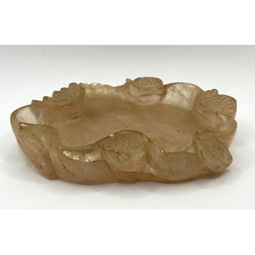 832 - A Chinese rose quartz shallow bowl, carved flowers, 11 cm wide