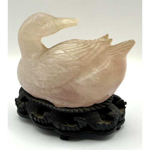 833 - A Chinese rose quartz carving of a duck, 9 cm wide, and a shallow bowl, on a hardwood base, 12 cm wi... 