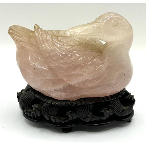 833 - A Chinese rose quartz carving of a duck, 9 cm wide, and a shallow bowl, on a hardwood base, 12 cm wi... 