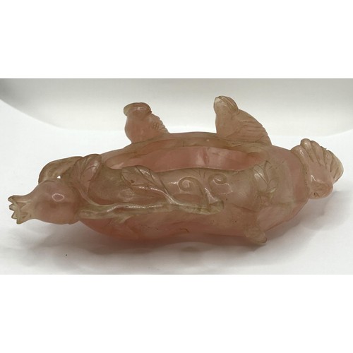 833 - A Chinese rose quartz carving of a duck, 9 cm wide, and a shallow bowl, on a hardwood base, 12 cm wi... 