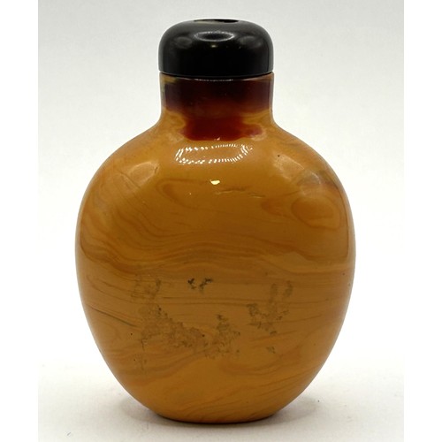 840 - A Chinese carving of fruit, 6 cm wide, and a snuff bottle, 6 cm high (2)