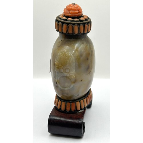 847 - A Chinese hardstone snuff bottle on stand, 10 cm high, three carved red stone figures, and assorted ... 