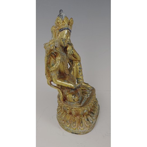 861 - A gilt bronze Buddha, 20 cm high