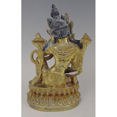 861 - A gilt bronze Buddha, 20 cm high