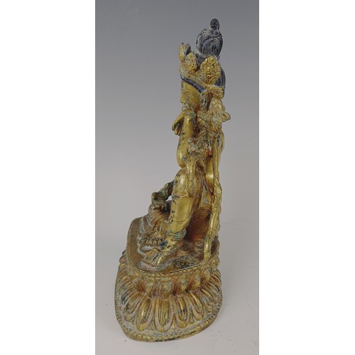 861 - A gilt bronze Buddha, 20 cm high