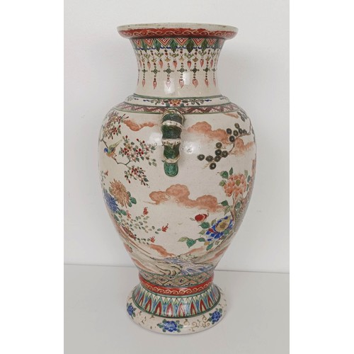 909 - A Japanese pottery vase, decorated a peacock and pheasants, 37 cm high