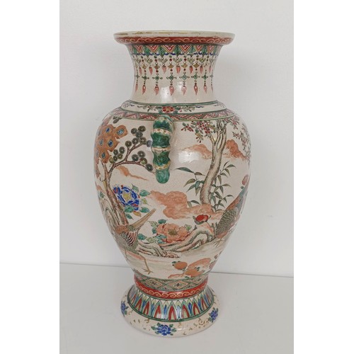 909 - A Japanese pottery vase, decorated a peacock and pheasants, 37 cm high