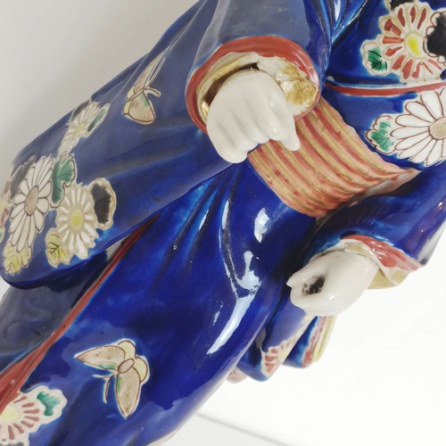 910 - A Japanese figure of a lady, 43 cm high