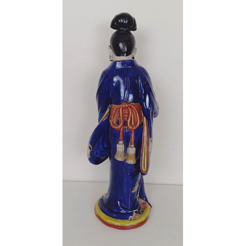 910 - A Japanese figure of a lady, 43 cm high