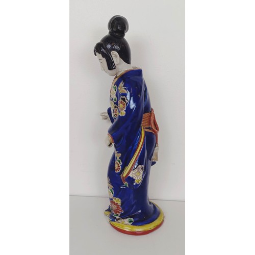 910 - A Japanese figure of a lady, 43 cm high