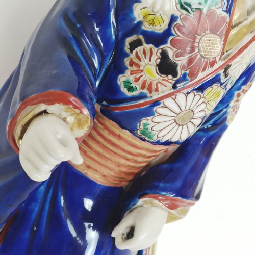 910 - A Japanese figure of a lady, 43 cm high