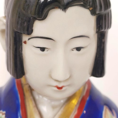 910 - A Japanese figure of a lady, 43 cm high