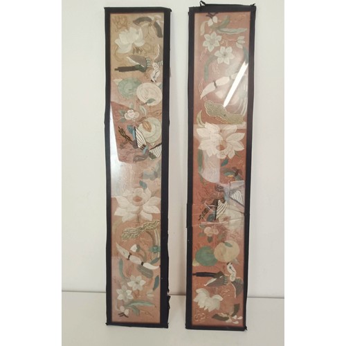 919 - A pair of Chinese embroidered sleeves, framed, 56 x 11 cm