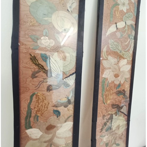 919 - A pair of Chinese embroidered sleeves, framed, 56 x 11 cm