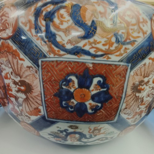 930 - A large pair of Japanese Imari planters, with various cartouches decorated figures, character mark t... 