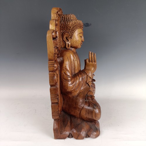 931 - A large carved wooden Buddha, 53 cm high