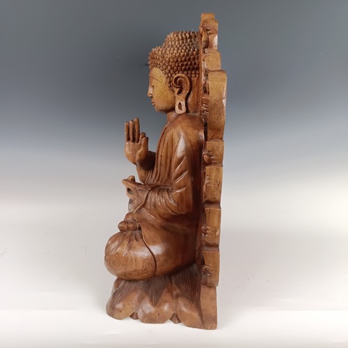 931 - A large carved wooden Buddha, 53 cm high