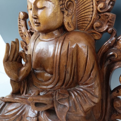 931 - A large carved wooden Buddha, 53 cm high