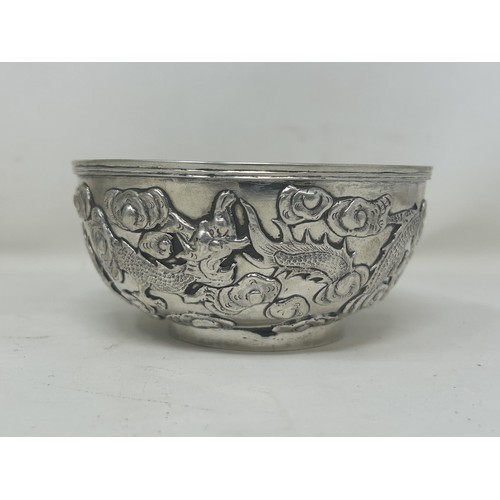 841 - A set of six Chinese silver coloured metal bowls, decorated dragons, Wang Hing, 11 cm diameter (6)