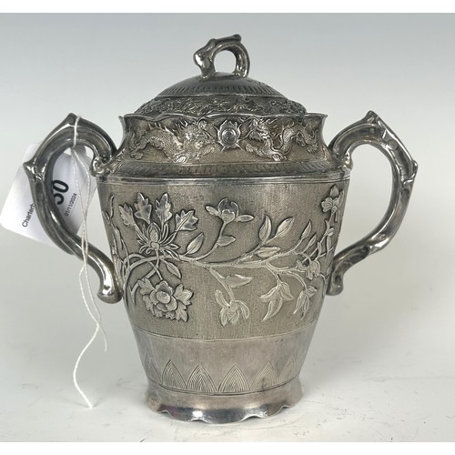 850 - A Chinese silver coloured metal two handle cup and cover, with embossed dragons, foliage, and Chines... 