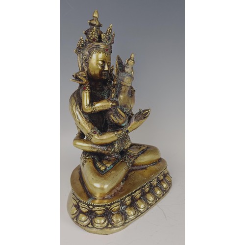 947 - A gilt bronze Buddha, 33 cm high