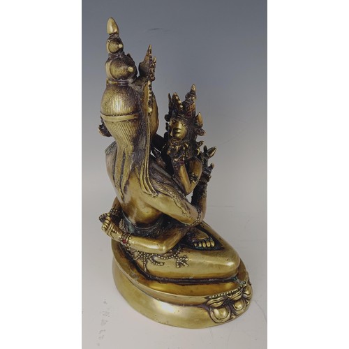 947 - A gilt bronze Buddha, 33 cm high