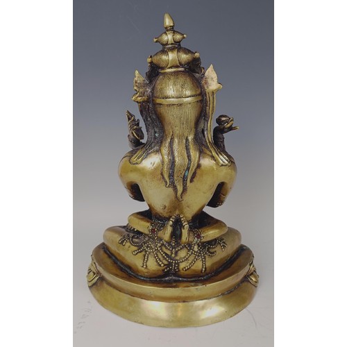 947 - A gilt bronze Buddha, 33 cm high